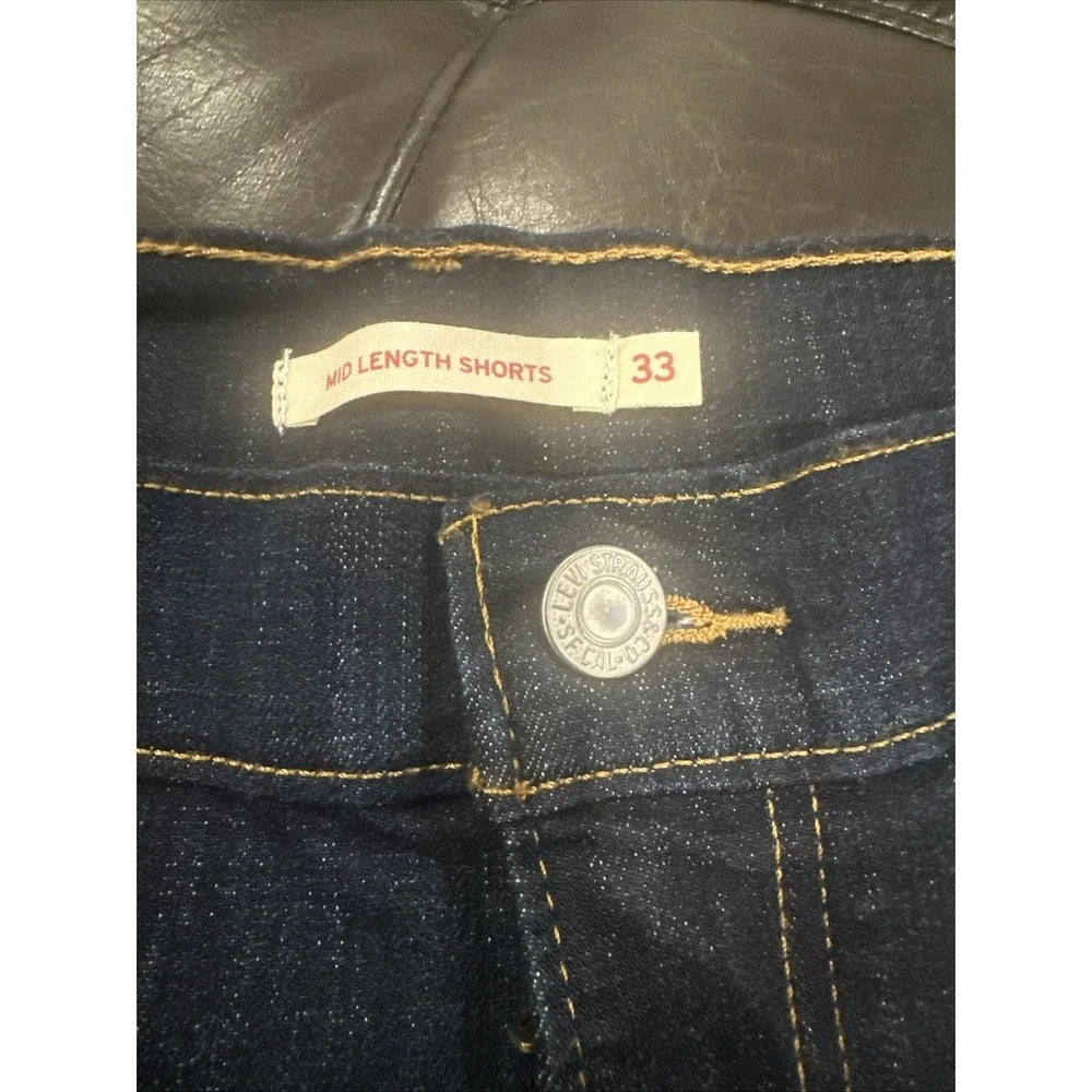 Levi's Women Size 33 Mid Length Blue Denim Shorts Cuffed Dark Distressed Stretch